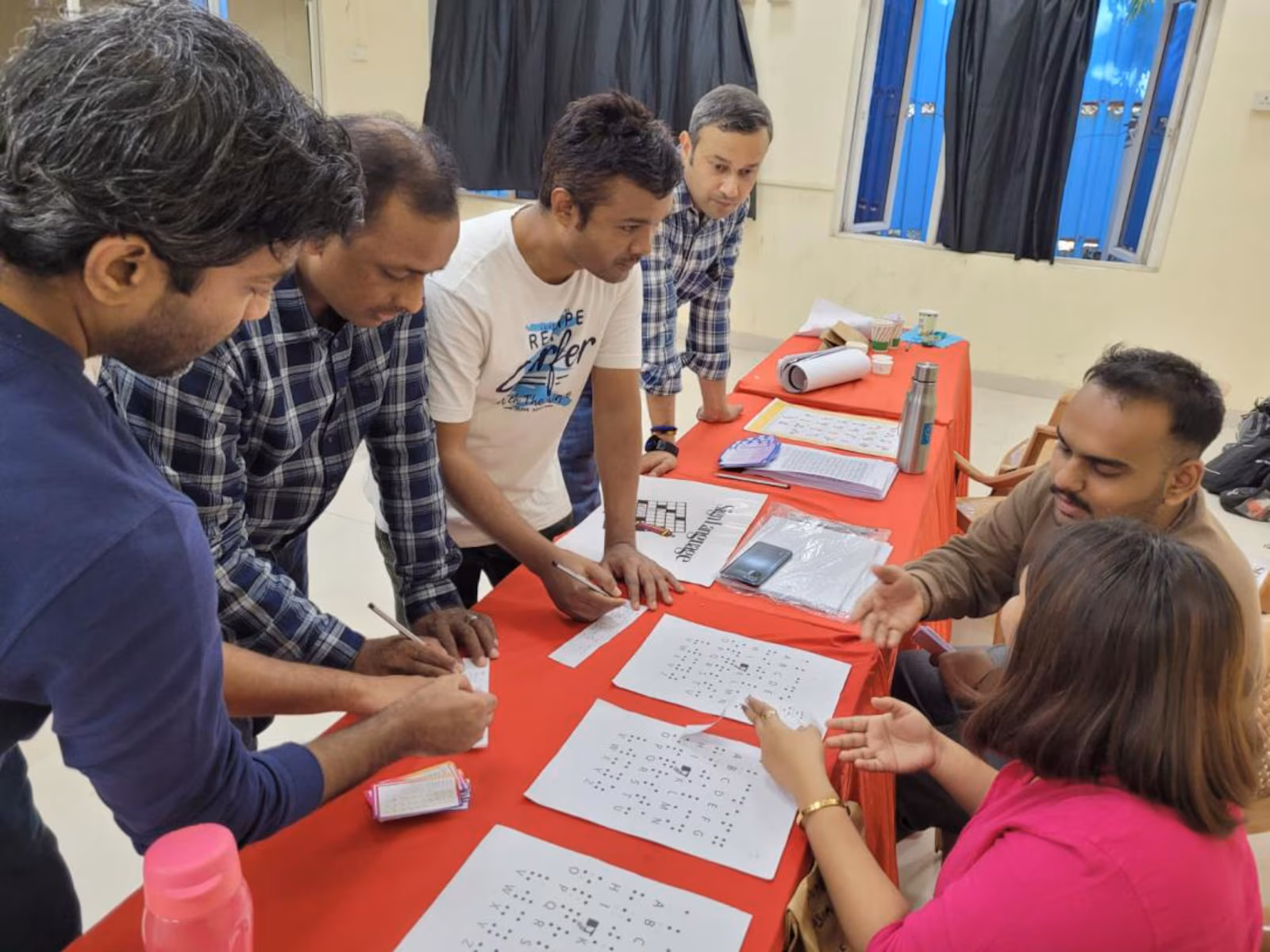 People filling out documents on a table