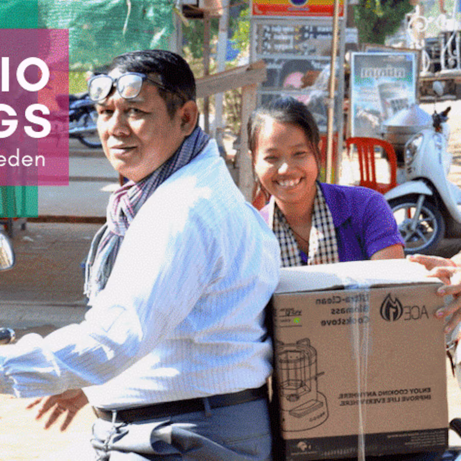 Man and woman smiling holding box
