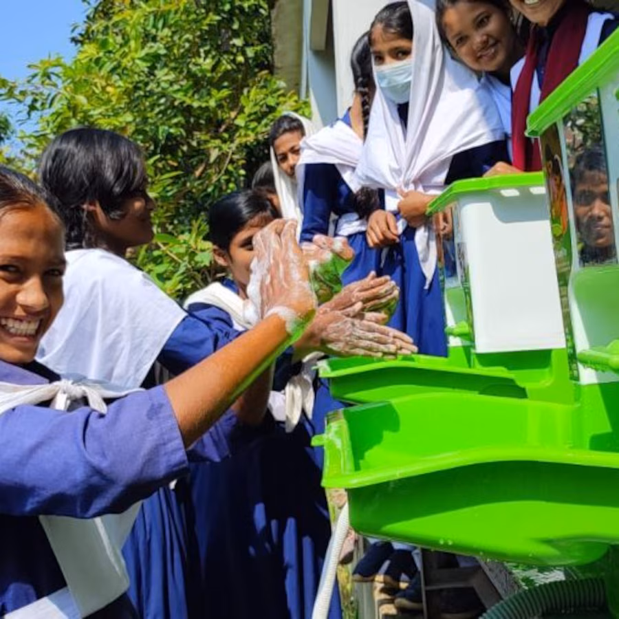 Young women washing hands