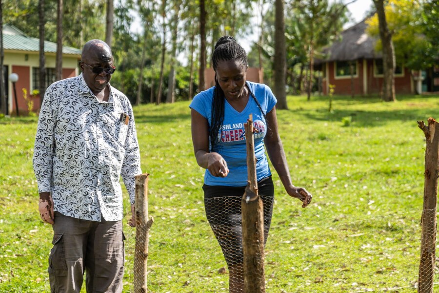 Maurine Akeyo, an agronomist visits her clients to check up the fruit tree seedlings as well as advice on attending to them.