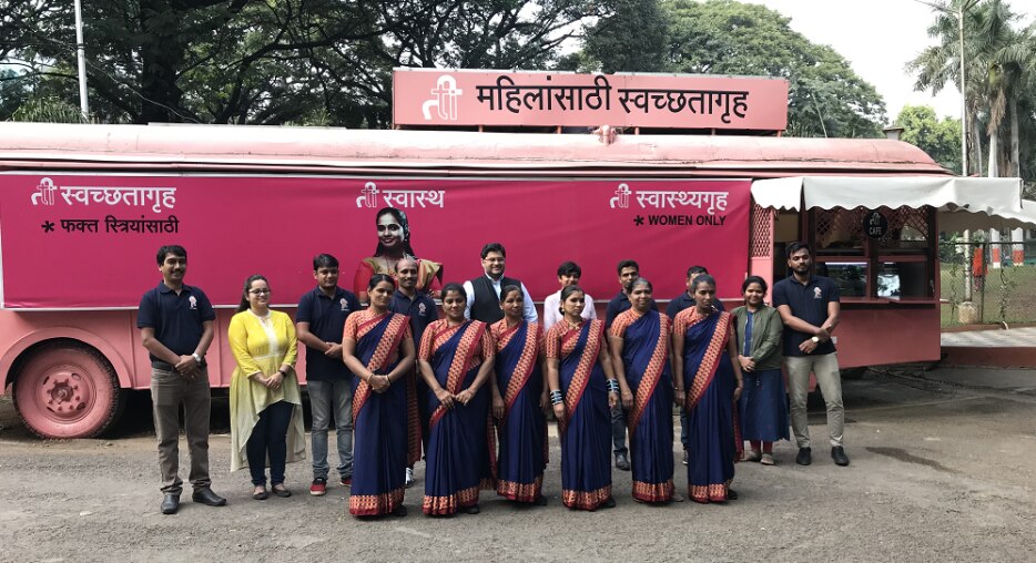Women stood in front of bus