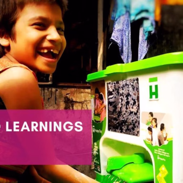 Young boy washing hands with HappyTap