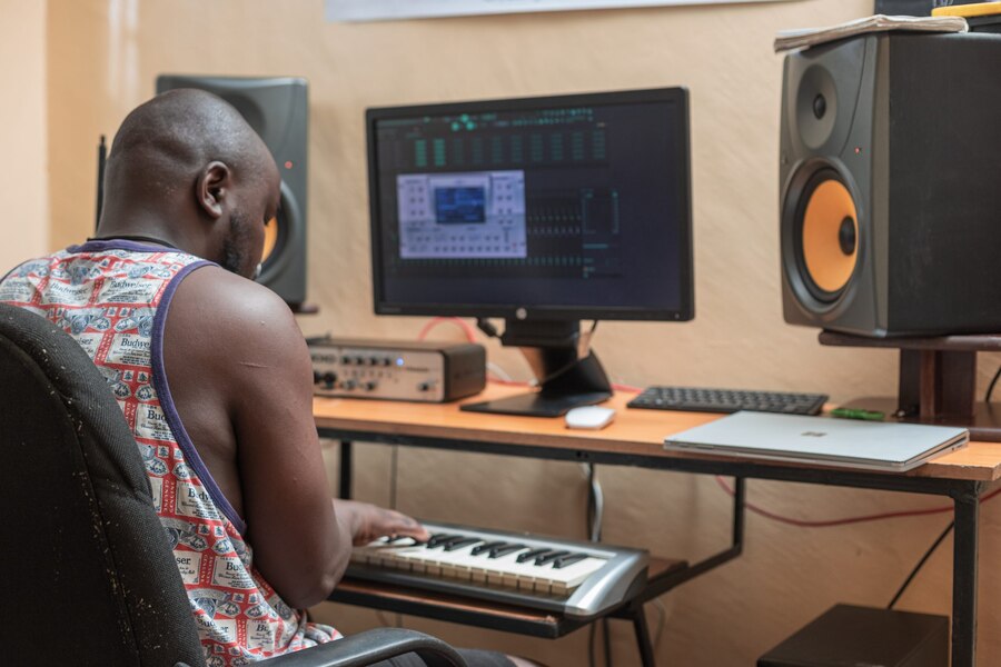 James playing the keyboard at desk