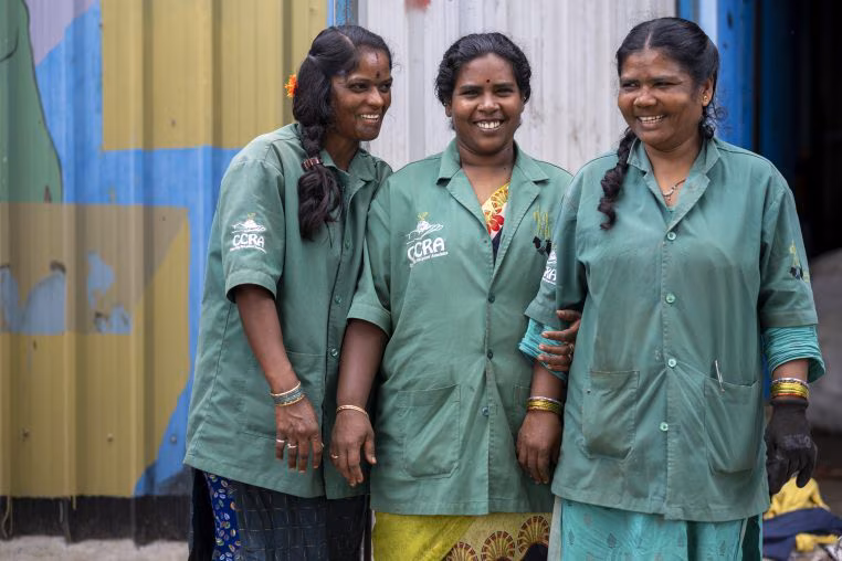 Three women smiling