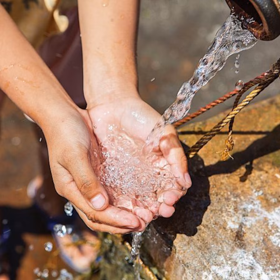 Washing hands under tap