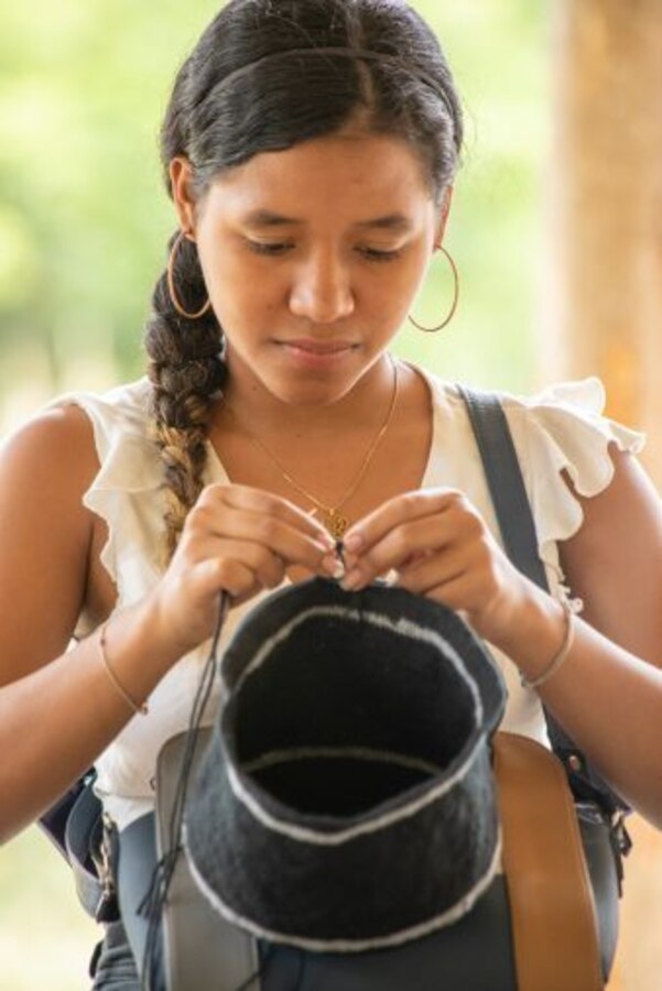 Artist weaves pot