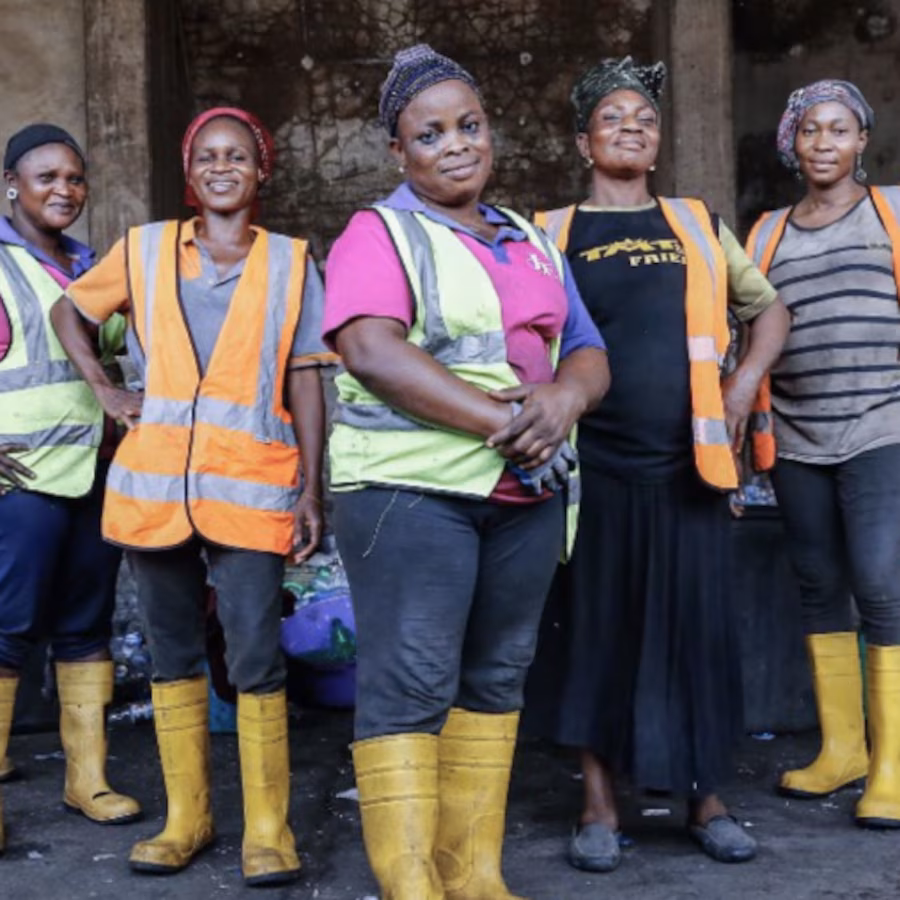 Women standing in front of waste