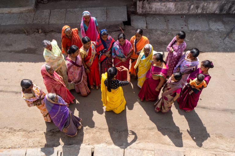 Aerial photo of women in Saari's speaking